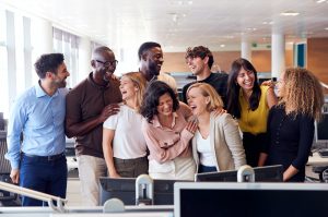 Happy Business Team Working In Modern Office Laughing Together